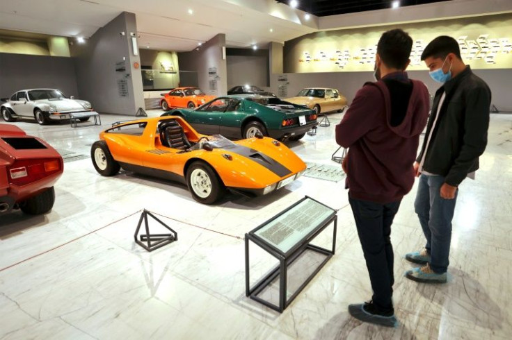 Visitors look at a 1972 MPV automobile by the three famous German car manufactures Mercedes-Benz, Porsche and Volkswagen  at the IIran Historical Car Museum