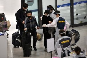 South Korea has tightened travel restrictions after detecting its first cases of the Omicron coronavirus variant