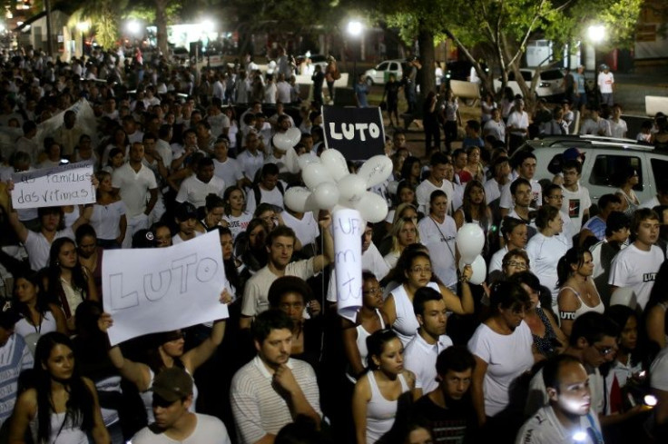 Residents of the Brazilian town of Santa Maria march demanding justice and in memory of 242 people who died in a nightclub fire in 2013