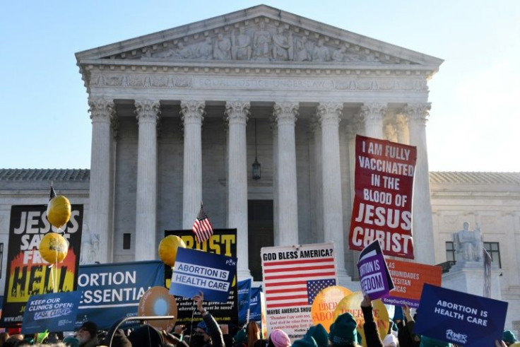 Demonstrators gathered outside the US Supreme Court as the justices prepared to hear a case that could roll back abortion rights