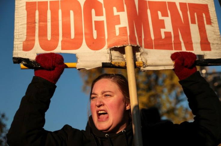 A demonstrator holds a sign outside the US Supreme Court as the justices prepare to hear a case that could roll back abortion rights