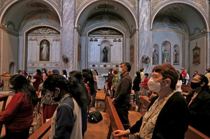 Worshippers in Nicosia, Cyprus attend a mass on November 14, 2021 at the Roman Catholic Church of the Holy Cross, where Pope Francis is to hold an ecumenical prayer with migrants