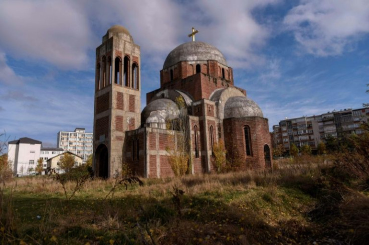 Some Kosovars think the unfinished church in Pristina is a reminder of Kosovo's bloody past