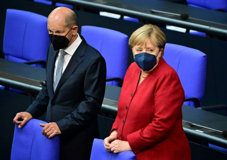 Chancellor Merkel and her designated successor Scholz are in talks to tackle Covid infections in Germany