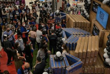 Shoppers buy TV sets at a megastore during a Black Friday sale in Sao Paulo, Brazil, on November 25, 2021