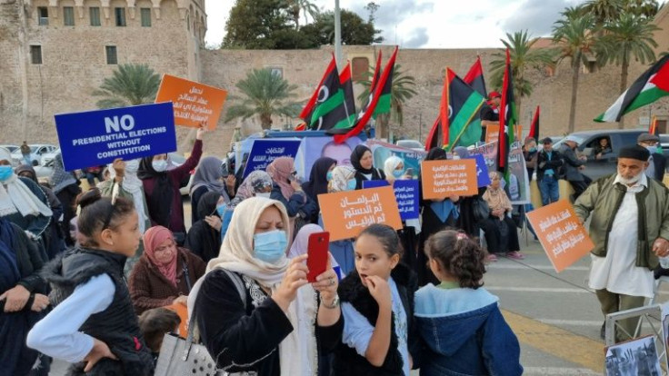 People gather at  Martyrs' Square in Libya's capital Tripoli on November 19, 2021, to protest the presidential candidacy of Seif al-Islam Kadhafi, son of slain Libyan dictator Moamer Kadhafi