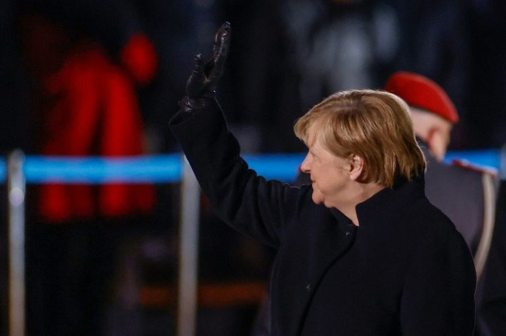 Merkel, seen waving goodbye at her ceremonial send-off, said her 16 years in office "challenged me politically and humanly and at the same time, they were also fulfilling"