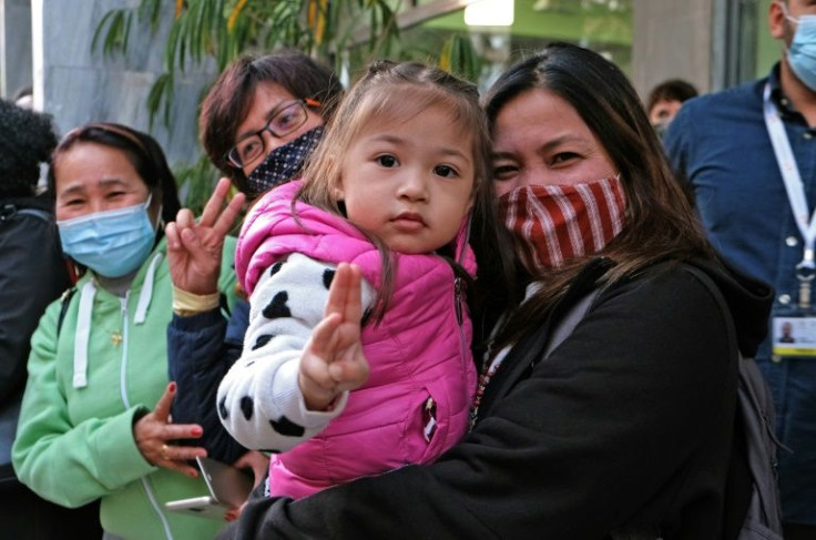 Philippines citizens residing in Cyprus gather as Pope Francis arrives at the Maronite Christian Lady of Grace cathedral in Nicosia, Europe's last divided capital, on December 2, 2021