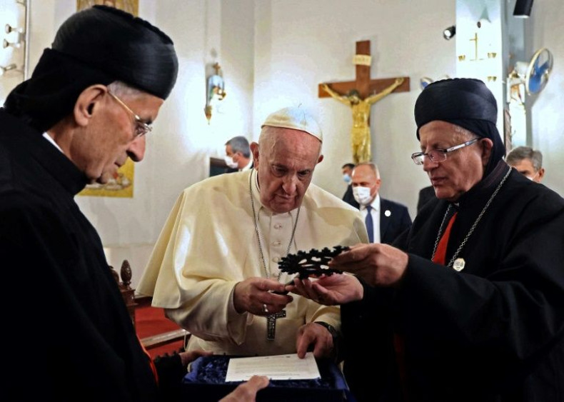 Pope Francis receives gifts from Lebanon's Christian Maronite Patriarch Beshara al-Rai, on the left, and the Archbishop of the Maronite Catholic community in Cyprus Selim Sfeir
