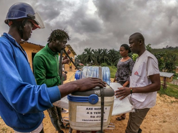 Transport task: A motorcycle driver loads vaccines for transport into rural areas in Seke Banza in western DR Congo