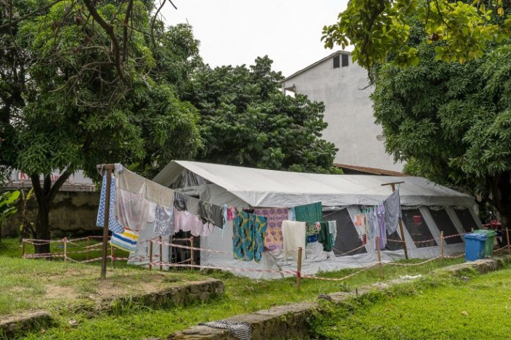 Laundry outside a vaccine centre in Kinshasa in May. Vaccine takeup has been poor in DR Congo - many citizens say they have concerns about the jab or argue that the risk from the virus is not so great