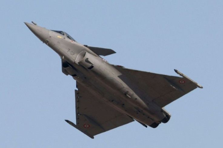 A French air force (Armee de l'air) Dassault Rafale multirole fighter aircraft performs aerial manuevers during the 2021 Dubai Airshow in the Gulf emirate on November 14, 2021