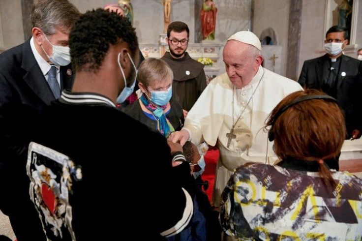 Pope Francis meets with migrants at the Church of the Holy Cross near the United Nations buffer zone in Nicosia