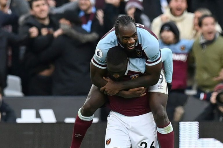 West Ham's Arthur Masuaku (below) celebrates his winning goal against Chelsea