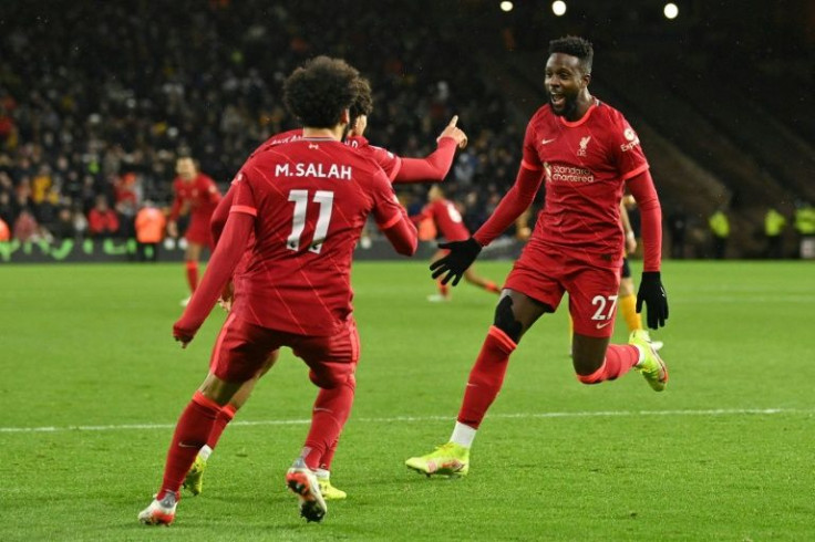 Liverpool striker Divock Origi (right) celebrates his late winning goal against Wolves