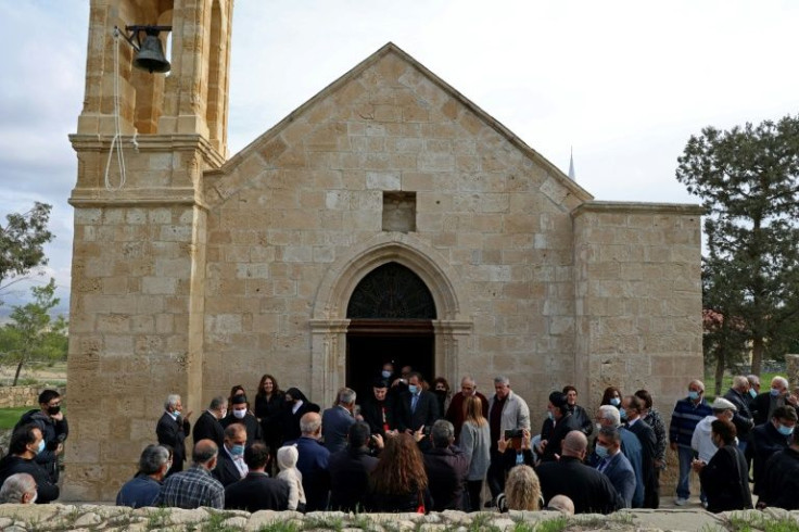 Authorities in the self-proclaimed Turkish Republic of Northern Cyprus allow Maronites to visit Agia Marina an average of just five times a year, during religious holidays, but an exception was made as a gesture to the visiting Maronite Patriarch (C)