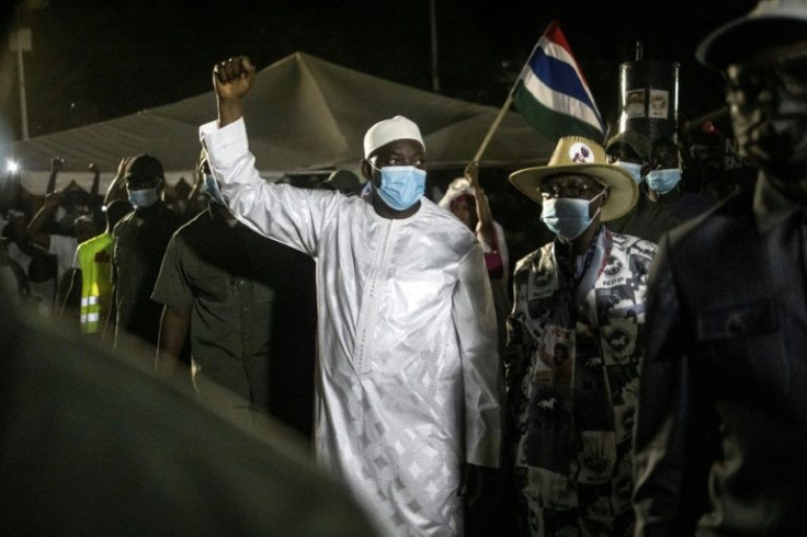 Adama Barrow (C) has run The Gambia since 2017