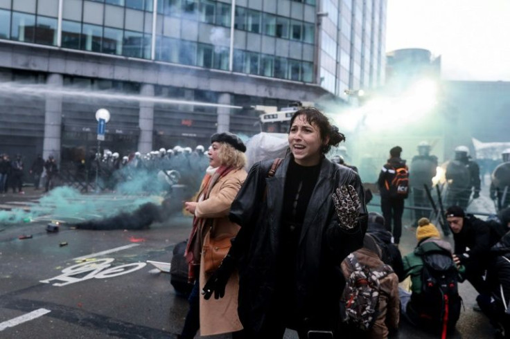 Belgian police deployed water cannon after protesters against compulsory anti-Covid measures threw fireworks near EU headquarters in Brussels
