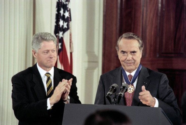 Former US senator Bob Dole being presented with the  Presidential Medal of Freedom in 1997 by Bill Clinton, who defeated him at the polls the year before