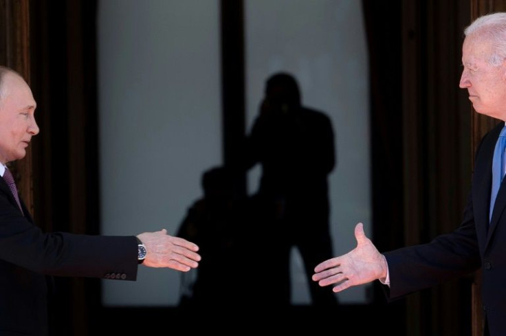 Russian President Vladimir Putin (L) shakes hands with US President Joe Biden ahead of their talks in Geneva on June 16, 2021; they will hold a virtual meeting on December 7, 2021