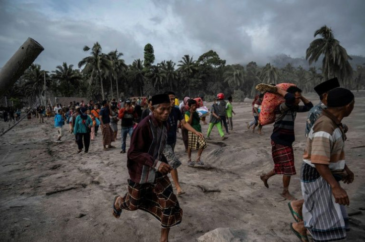 Dramatic footage showed Semeru pumping a mushroom of ash into the sky that loomed over screaming residents of a nearby village as they fled