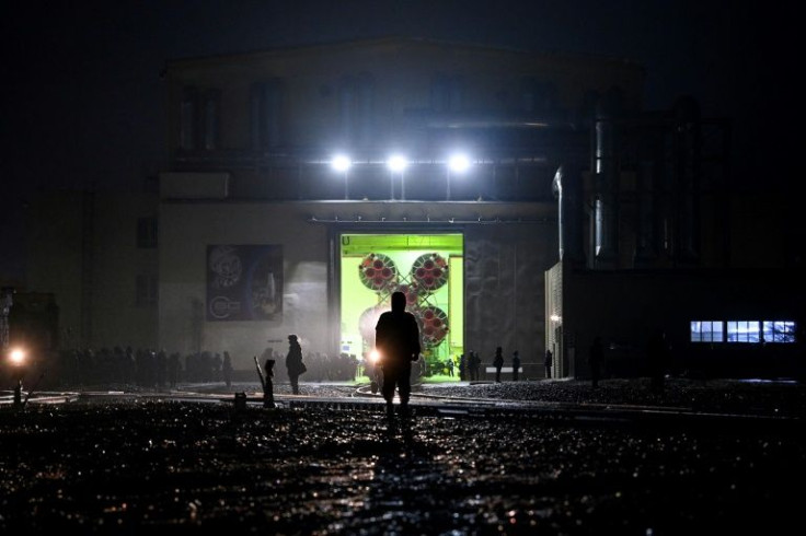 On Sunday morning, the Soyuz spacecraft with a Japanese flag and an 'MZ' logo for Maezawa's name was moved onto the launch pad in unusually wet weather for Baikonur