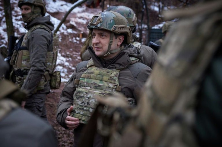 Ukrainian President Volodymyr Zelensky visits combat positions and meets with servicemen at the frontline with Russia-backed separatists in the Donetsk region on the Day of the Armed Forces of Ukraine