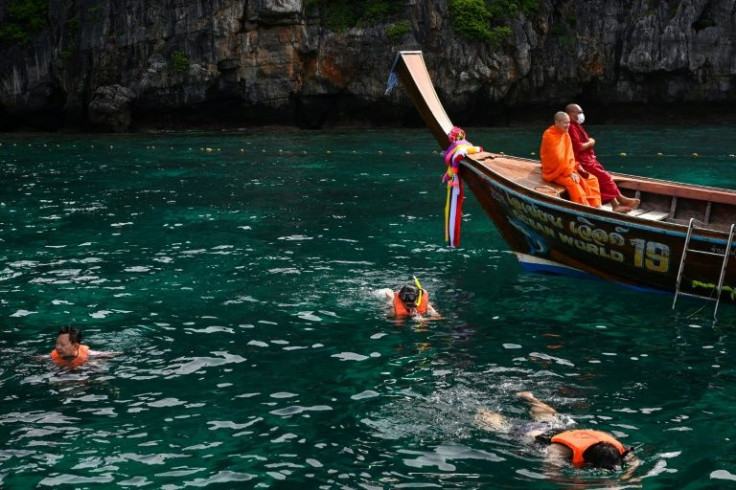 The number of visitors will be regulated on key sites of the archipelago, while boats anchoring on reefs and tourists feeding fish face $150 fines