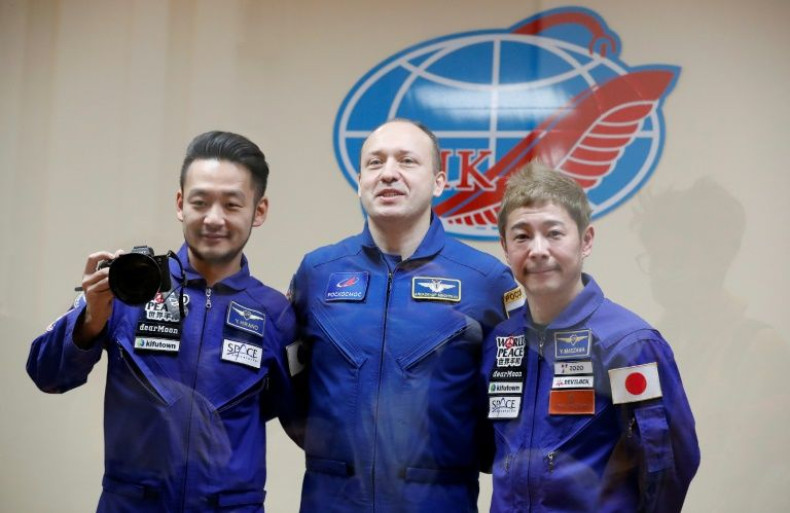 Russian cosmonaut Alexander Misurkin (C), Japanese billionaire Yusaku Maezawa (R) and his assistant Yozo Hirano will take part in a mission to the International Space Station