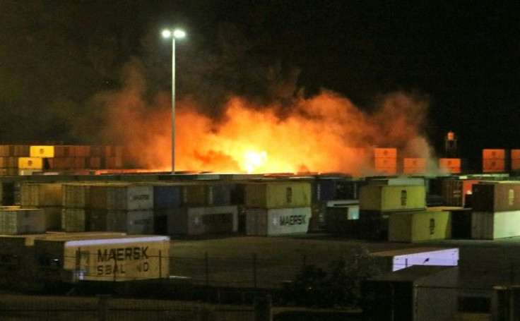 A fire blazes in the container yard of the Syrian port of Latakia after an Israeli air strike targeting an Iranian arms shipment