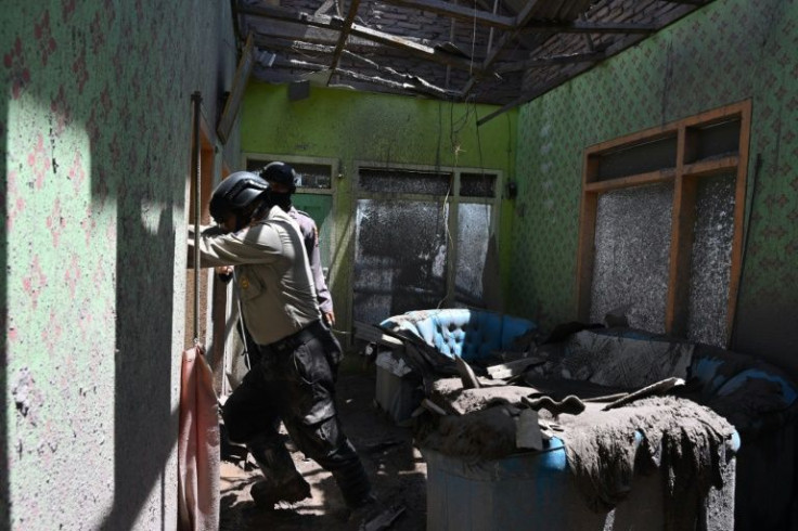 Rescue teams combed the destroyed homes for survivors and bodies