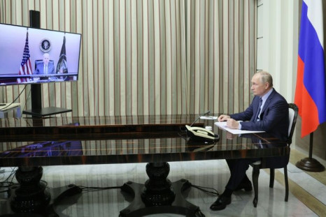 Russian President Vladimir Putin attends a meeting with US President Joe Biden via a video call
