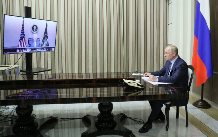 Russian President Vladimir Putin attends a meeting with US President Joe Biden via a video call