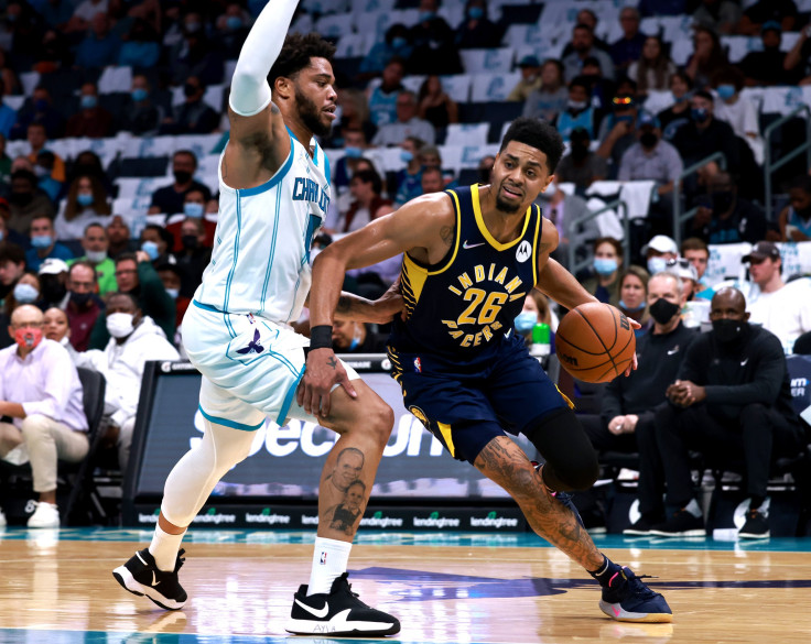 Miles Bridges #0 of the Charlotte Hornets defends Jeremy Lamb #26 of the Indiana Pacers