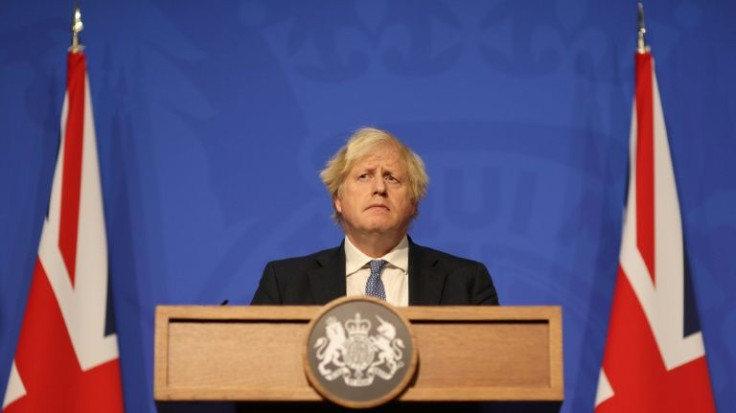 Britain's Prime Minister Boris Johnson, pictured on December 8, 2021, has said his country will not send ministers to the Winter Games in Beijing