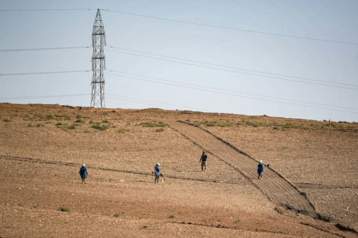 Sweeping for unexploded ordnance near Hassan-Jalad -- clearing the remnants of war is painstaking and dangerous work