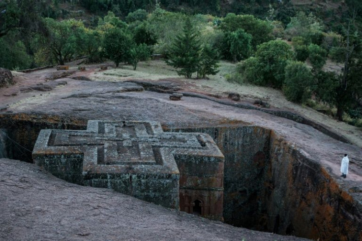 An Ethiopian Orthodox devotee prays at the Church of St. George on Tuesday. The famous site is one of 11 UNESCO-designated 'cave churches' in Lalibela that have been carved out of the rock