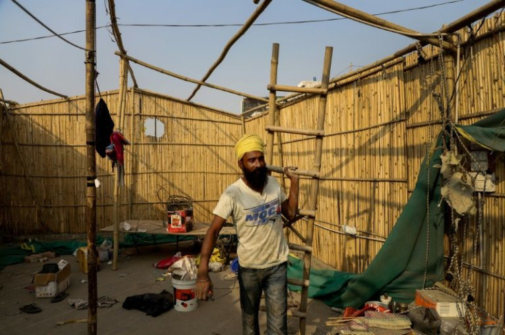 Indian farmers have agreed to end year-long mass protests after the government abandoned its push for agricultural reforms