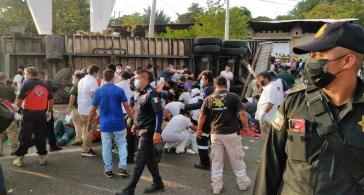 Police and rescue workers are seen after an accident in which at least 49 migrants died, in Tuxtla Gutierrez