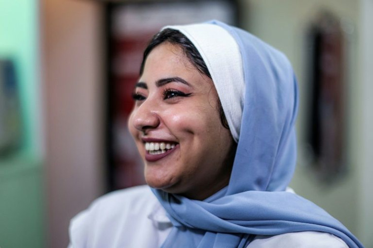 Shoruk Shaheen smiles at a clinic in Gaza City after undergoing dimple creation surgery