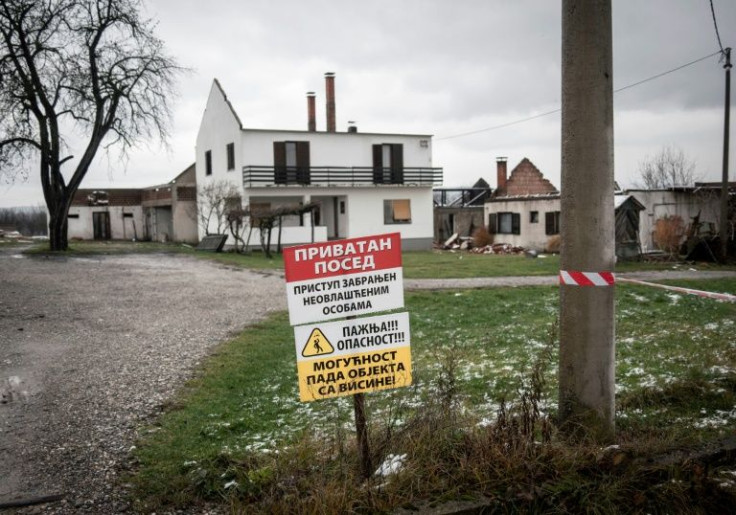 Access forbidden -- danger! warns a sign in front of a house sold to Rio Tinto, which has been paying top dollar to buy property where it wants to mine