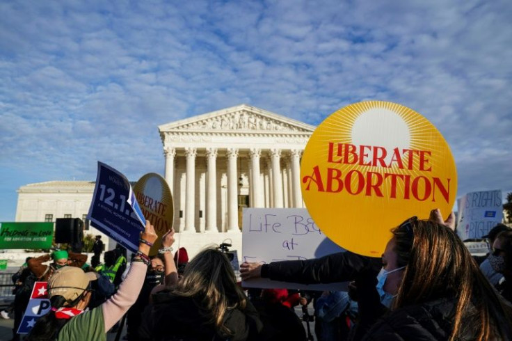 Protestors outside the US Supreme Court during oral arguments over a Mississippi law that bans abortion after 15 weeks of pregnancy