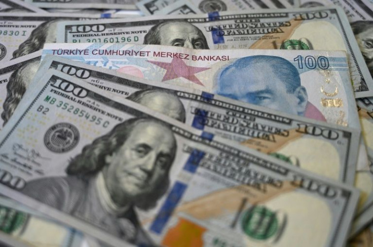 Turkey's economy is facing risks, including a depreciating lira currency, that prompted S&P Global Ratings to downgrade the country's credit rating outlook from stable to negative
