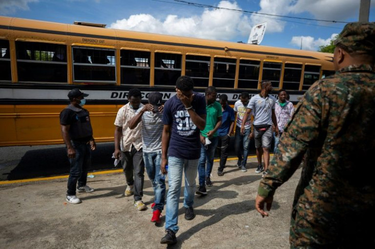 Dominican immigration agents use a yellow bus, of the type used for school transport, to round up and deport undocumented migrants