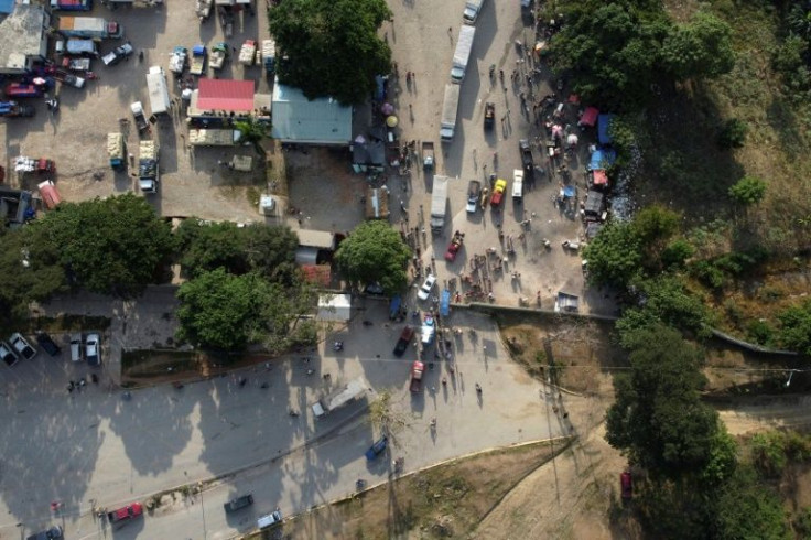 At the border town of Comendador, the migrants are given a Covid-19 test and food, before being taken back to Haiti