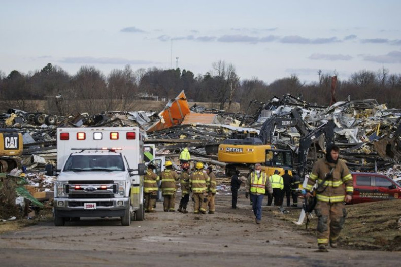 Emergency crews search through the debris of a flattened building in Mayfield, Kentucky
