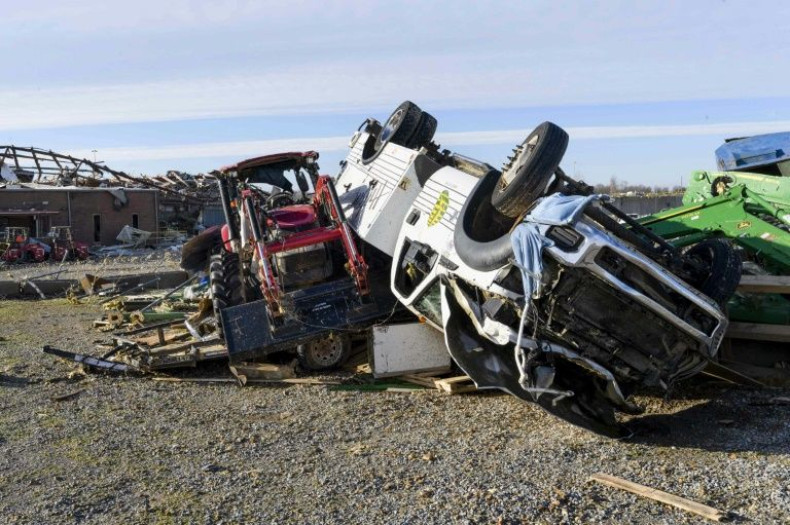 A truck and tractor are picured at a farm equipment dealership after an overnight  tornado decimated it, as well as a poulrty hatcchery behind it in Mayfield, Kentucky, on December 11, 2021