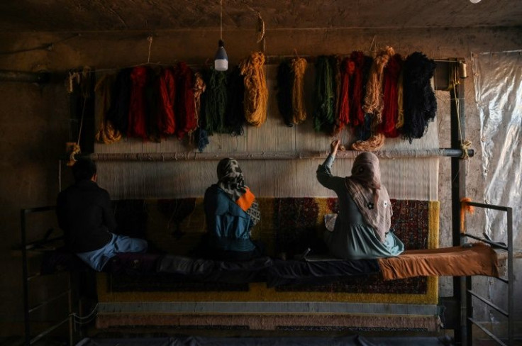 Many Afghans have turned to the carpet-making industry for work after the Taliban takeover sparked an economic crisis