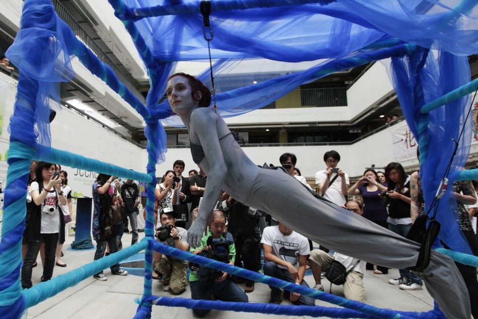 Woman protests slaughter of sharks