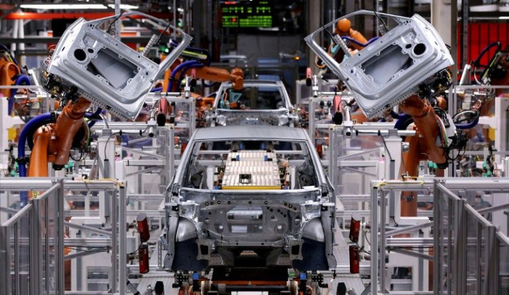 Robots mount doors on an ID.3 Volkswagen electric car. Germany's pivot to electric vehicles means carmakers are racing to retrain their workforces